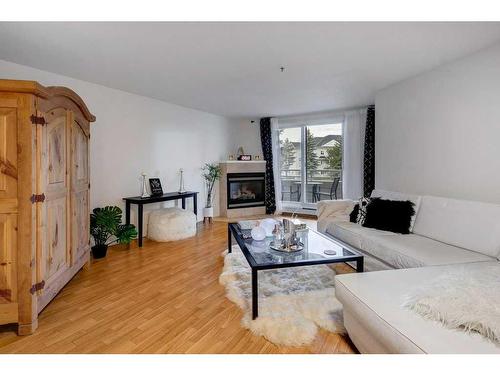 2209-11 Chaparral Ridge Drive Se, Calgary, AB - Indoor Photo Showing Living Room With Fireplace