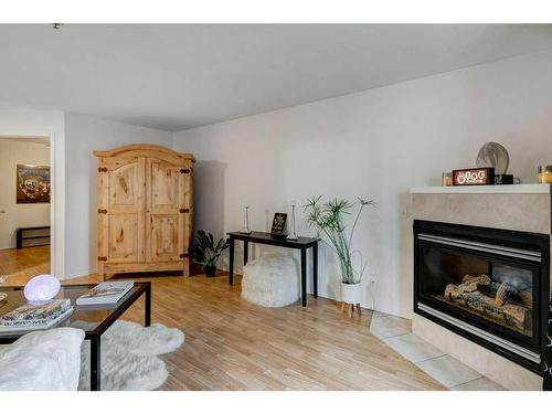 2209-11 Chaparral Ridge Drive Se, Calgary, AB - Indoor Photo Showing Living Room With Fireplace