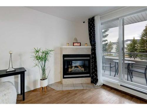 2209-11 Chaparral Ridge Drive Se, Calgary, AB - Indoor Photo Showing Living Room With Fireplace