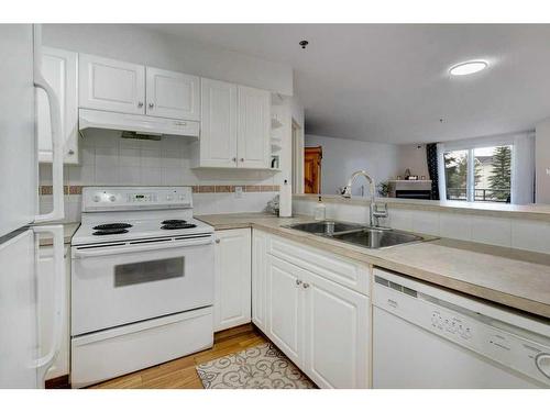 2209-11 Chaparral Ridge Drive Se, Calgary, AB - Indoor Photo Showing Kitchen With Double Sink