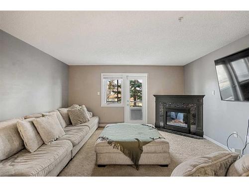 215-790 Kingsmere Crescent Sw, Calgary, AB - Indoor With Fireplace