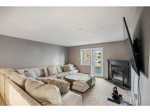 215-790 Kingsmere Crescent Sw, Calgary, AB - Indoor With Fireplace