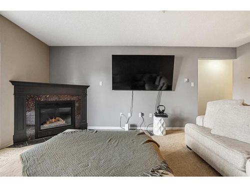 215-790 Kingsmere Crescent Sw, Calgary, AB - Indoor Photo Showing Living Room With Fireplace