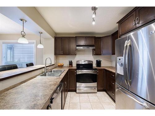 3049 Windsong Boulevard Sw, Airdrie, AB - Indoor Photo Showing Kitchen With Stainless Steel Kitchen With Double Sink