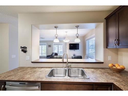 3049 Windsong Boulevard Sw, Airdrie, AB - Indoor Photo Showing Kitchen With Double Sink