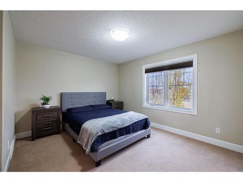 3049 Windsong Boulevard Sw, Airdrie, AB - Indoor Photo Showing Bedroom