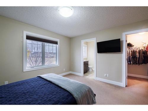 3049 Windsong Boulevard Sw, Airdrie, AB - Indoor Photo Showing Bedroom