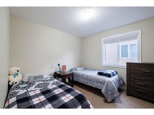 3049 Windsong Boulevard Sw, Airdrie, AB - Indoor Photo Showing Bedroom