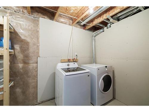 3049 Windsong Boulevard Sw, Airdrie, AB - Indoor Photo Showing Laundry Room