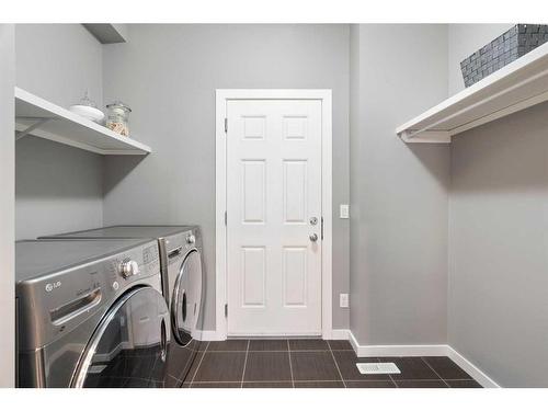 66 Legacy Close Se, Calgary, AB - Indoor Photo Showing Laundry Room