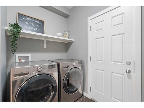 66 Legacy Close Se, Calgary, AB - Indoor Photo Showing Laundry Room