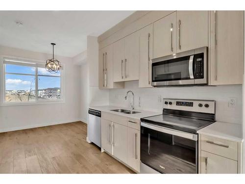 6327 128 Avenue Ne, Calgary, AB - Indoor Photo Showing Kitchen With Stainless Steel Kitchen With Double Sink