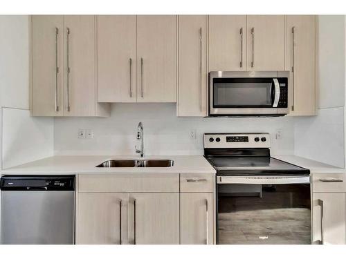 6327 128 Avenue Ne, Calgary, AB - Indoor Photo Showing Kitchen With Stainless Steel Kitchen With Double Sink