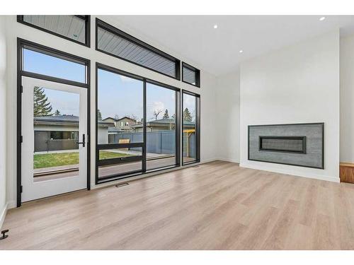 3D Willow Crescent Sw, Calgary, AB - Indoor Photo Showing Living Room With Fireplace