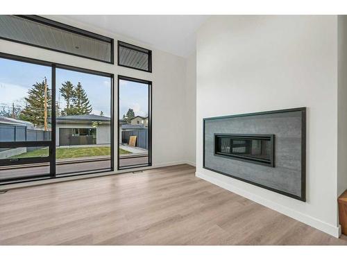 3D Willow Crescent Sw, Calgary, AB - Indoor Photo Showing Living Room With Fireplace