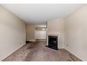 8106-315 Southampton Drive Sw, Calgary, AB  - Indoor With Fireplace 