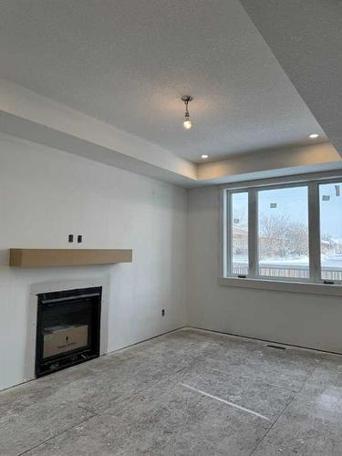 30 Clover Crescent, Beiseker, AB - Indoor With Fireplace