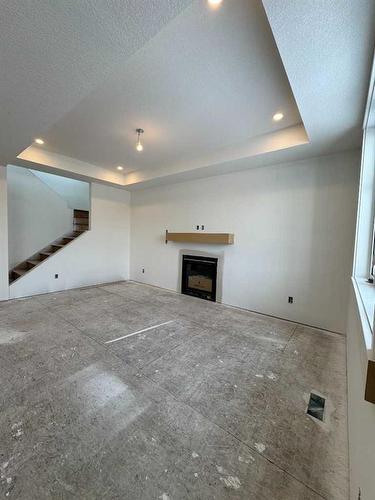 30 Clover Crescent, Beiseker, AB - Indoor With Fireplace