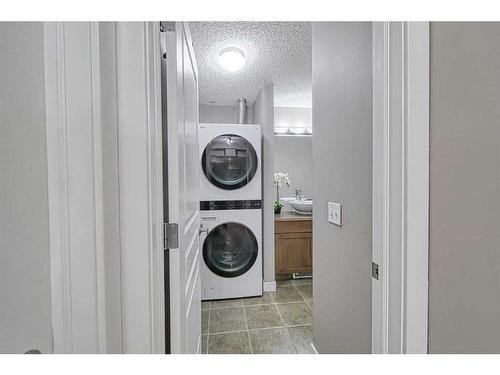 2101-211 Aspen Stone Boulevard Sw, Calgary, AB - Indoor Photo Showing Laundry Room