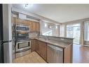 2101-211 Aspen Stone Boulevard Sw, Calgary, AB  - Indoor Photo Showing Kitchen With Stainless Steel Kitchen With Double Sink 