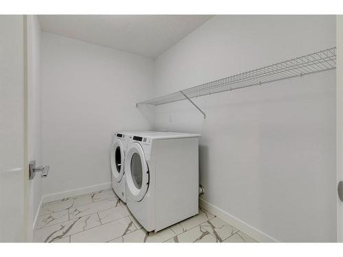 80 Crimson Ridge Place Nw, Calgary, AB - Indoor Photo Showing Laundry Room