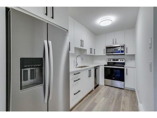 80 Crimson Ridge Place Nw, Calgary, AB - Indoor Photo Showing Kitchen With Stainless Steel Kitchen