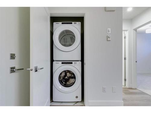 80 Crimson Ridge Place Nw, Calgary, AB - Indoor Photo Showing Laundry Room