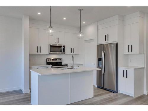 80 Crimson Ridge Place Nw, Calgary, AB - Indoor Photo Showing Kitchen With Stainless Steel Kitchen With Double Sink With Upgraded Kitchen