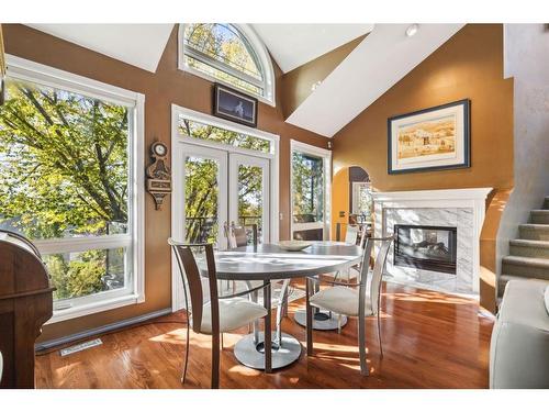 44 Sierra Vista Close Sw, Calgary, AB - Indoor Photo Showing Dining Room With Fireplace