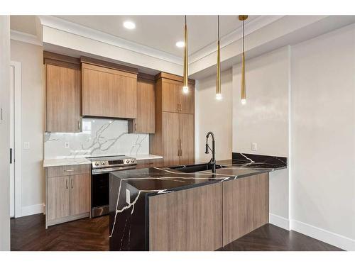 105-370 Dieppe Drive Sw, Calgary, AB - Indoor Photo Showing Kitchen With Double Sink