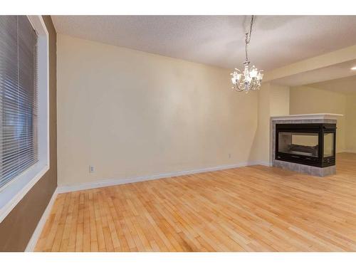 47 Prestwick Grove Se, Calgary, AB - Indoor With Fireplace