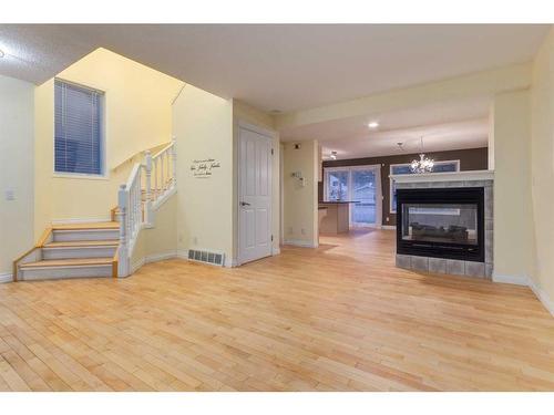 47 Prestwick Grove Se, Calgary, AB - Indoor Photo Showing Living Room With Fireplace