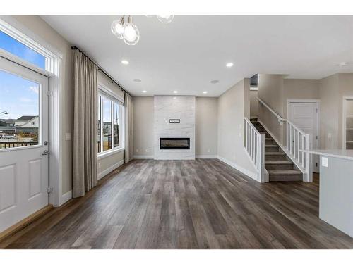 19 Homestead Close Ne, Calgary, AB - Indoor Photo Showing Other Room With Fireplace