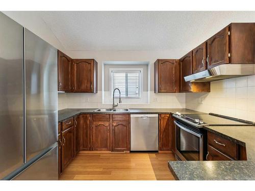 48 Macewan Meadow Rise Nw, Calgary, AB - Indoor Photo Showing Kitchen With Double Sink