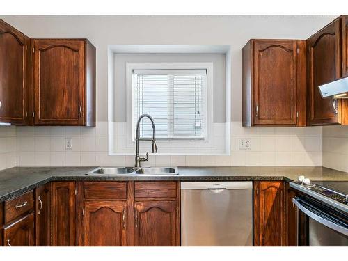 48 Macewan Meadow Rise Nw, Calgary, AB - Indoor Photo Showing Kitchen With Double Sink