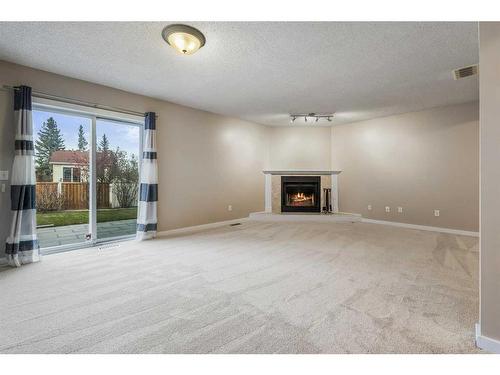 48 Macewan Meadow Rise Nw, Calgary, AB - Indoor With Fireplace