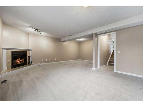 48 Macewan Meadow Rise Nw, Calgary, AB - Indoor With Fireplace