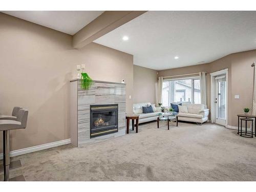 9 Simcrest Manor Sw, Calgary, AB - Indoor With Fireplace