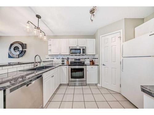 29 Chaparral Ridge Terrace Se, Calgary, AB - Indoor Photo Showing Kitchen With Double Sink