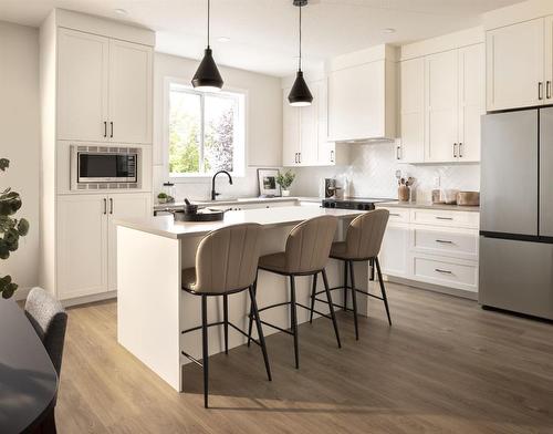 1001-201 Cooperswood Green Sw, Airdrie, AB - Indoor Photo Showing Kitchen With Stainless Steel Kitchen With Upgraded Kitchen