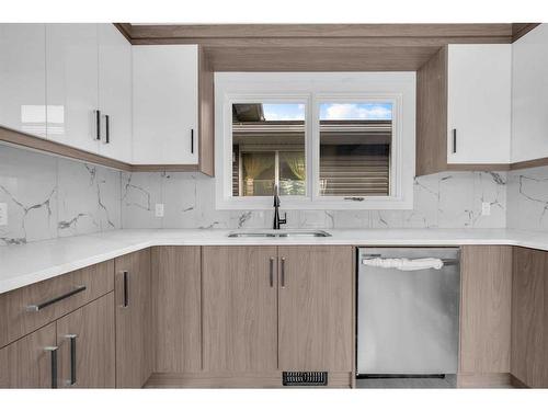 59 Tararidge Close Ne, Calgary, AB - Indoor Photo Showing Kitchen With Double Sink