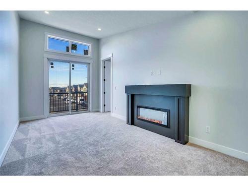 160 Saddlelake Manor Ne, Calgary, AB - Indoor Photo Showing Living Room With Fireplace