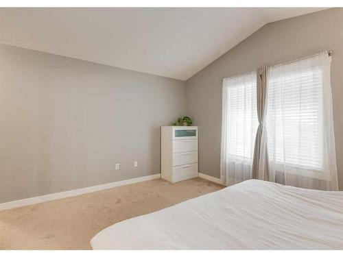 15 Baysprings Way Sw, Airdrie, AB - Indoor Photo Showing Bedroom