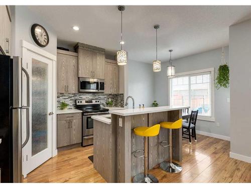 15 Baysprings Way Sw, Airdrie, AB - Indoor Photo Showing Kitchen With Stainless Steel Kitchen With Upgraded Kitchen