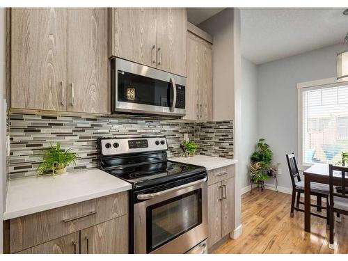 15 Baysprings Way Sw, Airdrie, AB - Indoor Photo Showing Kitchen With Upgraded Kitchen