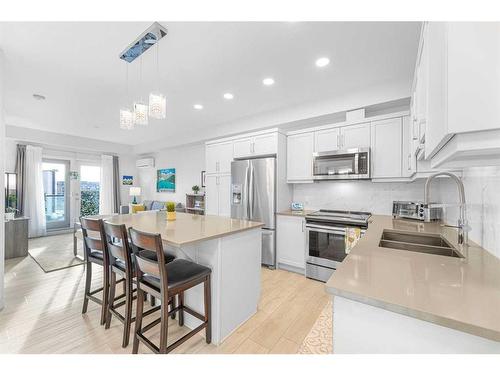 2407-10 Market Boulevard Se, Airdrie, AB - Indoor Photo Showing Kitchen With Double Sink With Upgraded Kitchen