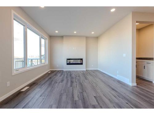 172 Mallard Grove Se, Calgary, AB - Indoor Photo Showing Living Room With Fireplace