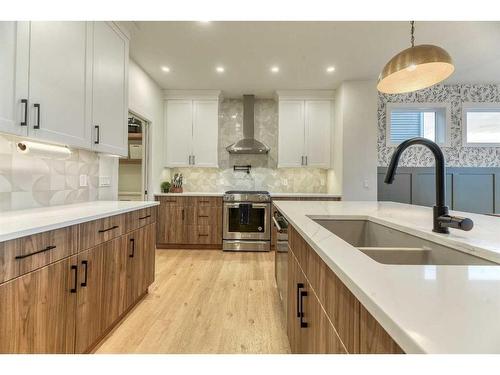 15 Bearberry Lane, Okotoks, AB - Indoor Photo Showing Kitchen With Double Sink With Upgraded Kitchen