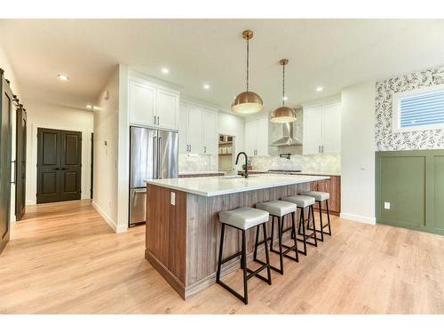 15 Bearberry Lane, Okotoks, AB - Indoor Photo Showing Kitchen With Upgraded Kitchen