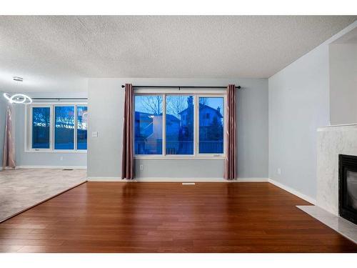 78 Evansmeade Circle Nw, Calgary, AB - Indoor With Fireplace